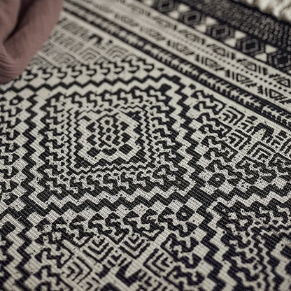 Close-up of a black and white geometric patterned fabric.
