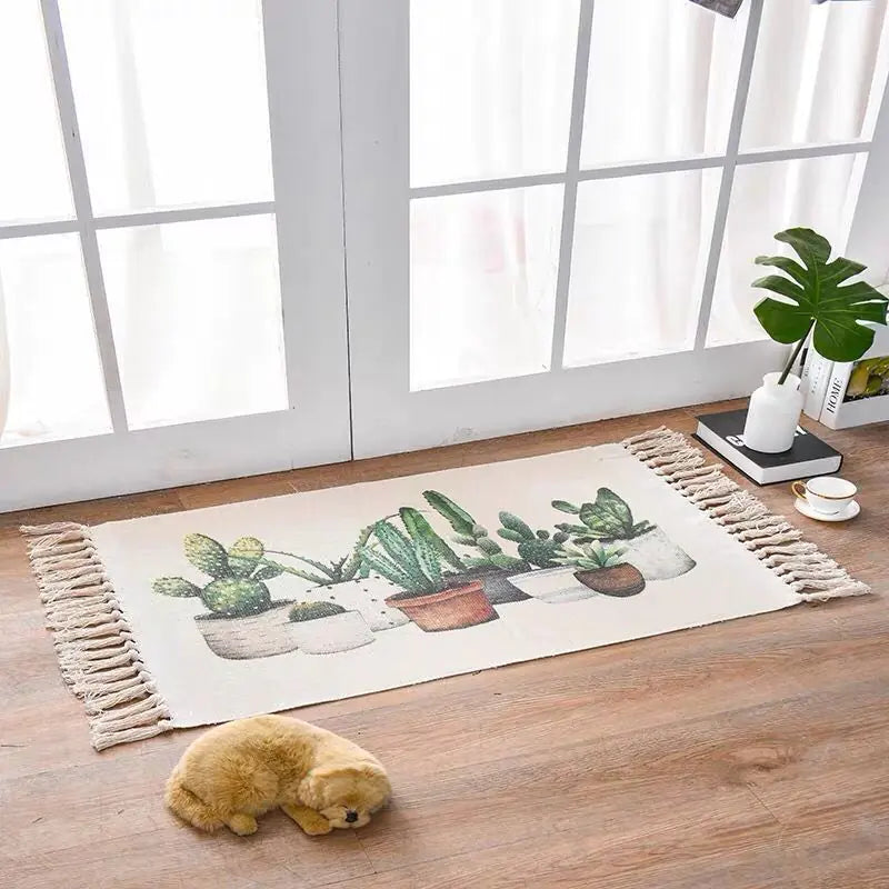Decorative rug with cactus design on a wooden floor near a window.