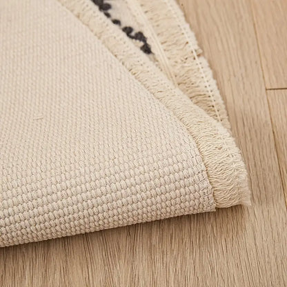 Beige textured rug on a wooden floor