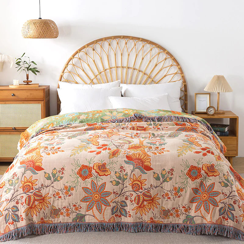 Bed with floral comforter in a bedroom setting