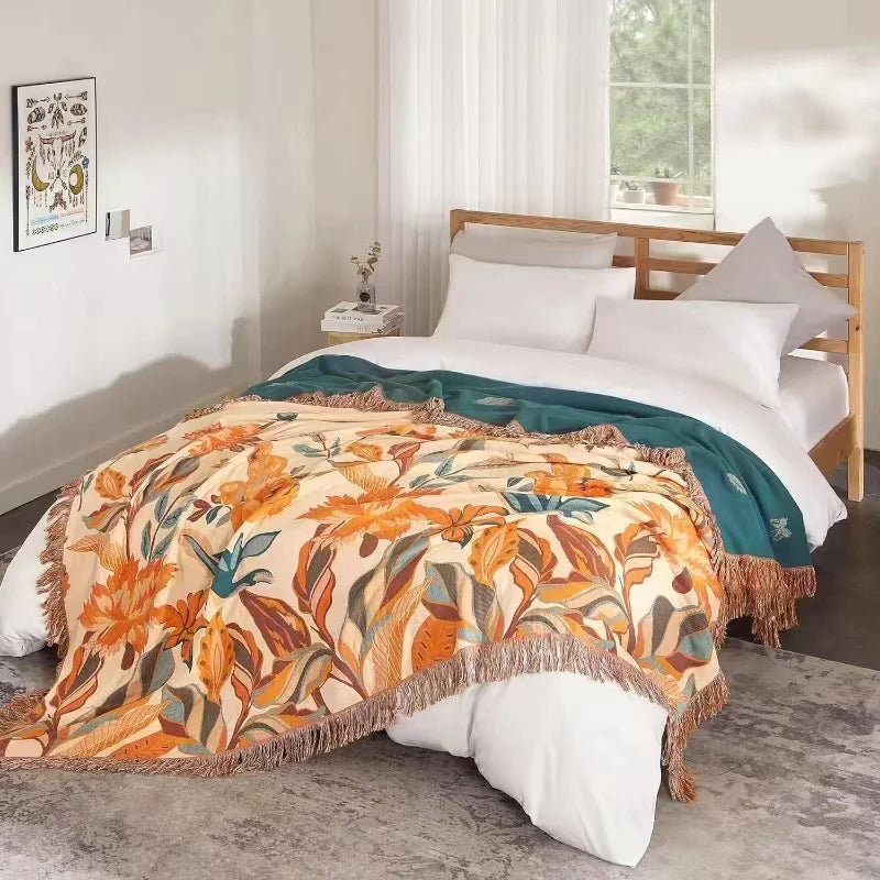Bed with floral patterned comforter in a bedroom setting