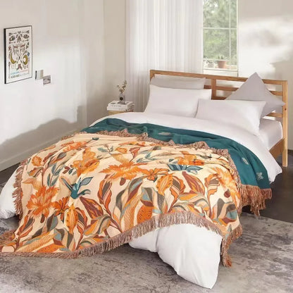 Bed with floral patterned comforter in a bedroom setting