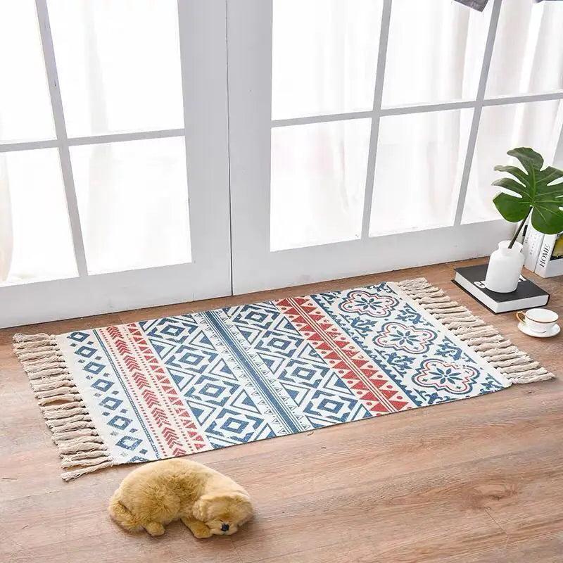 Decorative rug with geometric pattern on a wooden floor in a bright room.