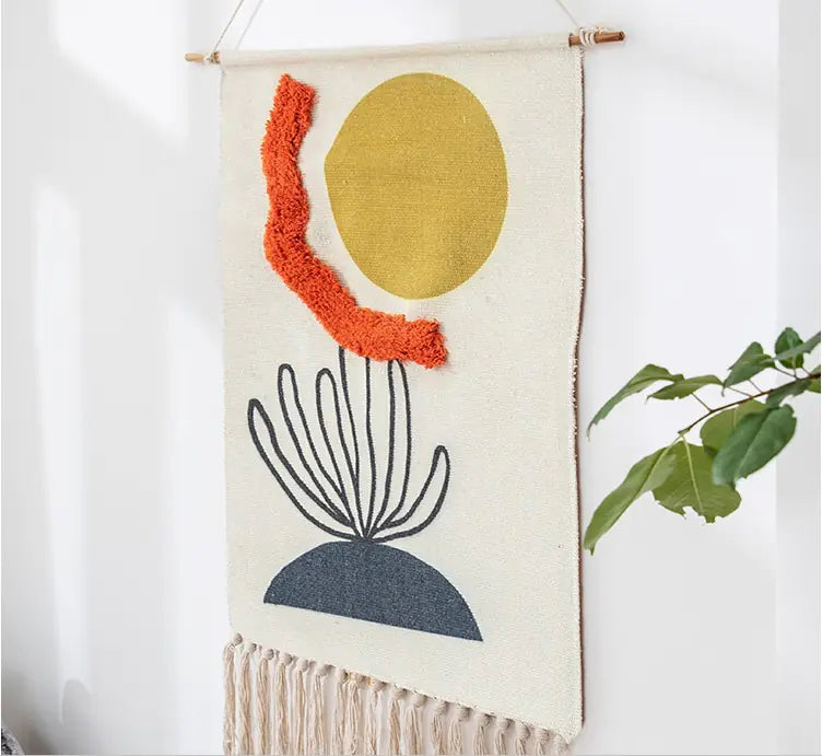 Woven wall art with geometric shapes on a white background