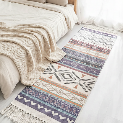 Patterned rug on a bed with neutral bedding