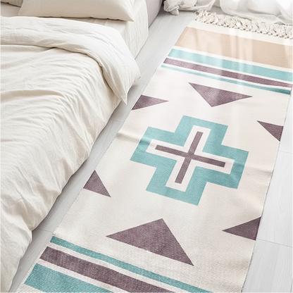Geometric patterned rug on a bed with white bedding