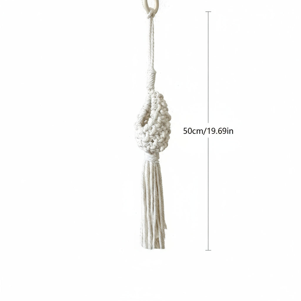 Macrame wall hanging with measurements on a white background