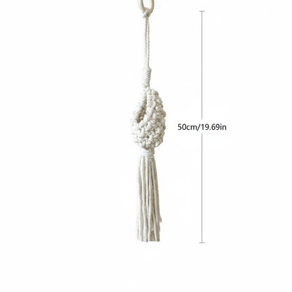 Macrame wall hanging with measurements on a white background
